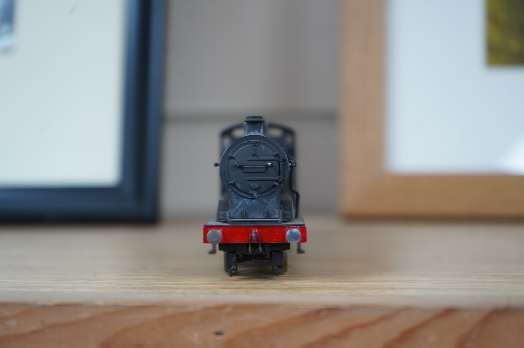 Two kit built and adapted EM gauge LMS railway locomotives; an 0-8-0, 9518, and an 0-6-0 class 4F based on an Airfix kit, together with the body only of an SR Schools Class